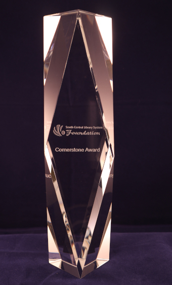 The Cornerstone Award is shaped like a glass obelisk